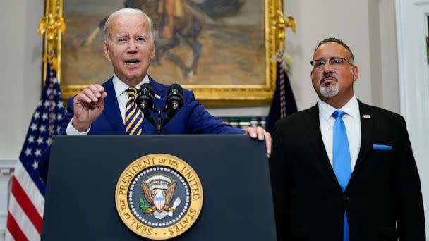 PHOTO: President Joe Biden speaks about student loan debt forgiveness with Education Secretary Miguel Cardona in the Roosevelt Room of the White House, Aug. 24, 2022. (Evan Vucci/AP)