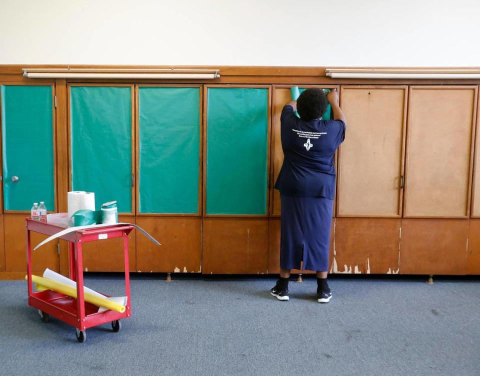 Development Director Lori Franklin decorates a room for the final open house at Our Lady of Victory Catholic School in Fort Worth. Mass will be held Saturday from 9 a.m. to 11 a.m. with an open house following from noon to 5 p.m.