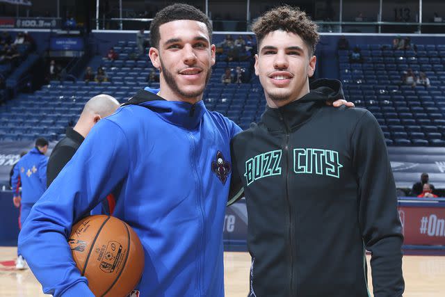 <p>Layne Murdoch Jr./NBAE via Getty</p> Lonzo Ball and LaMelo Ball