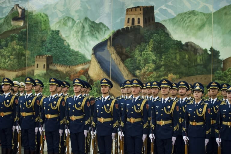 Chinese honour guards stand during a welcome ceremony for South Korean President Moon Jae-In