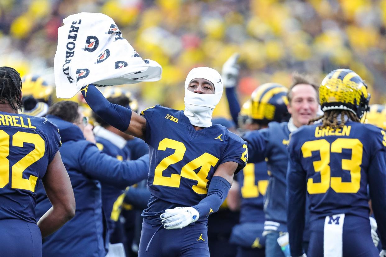 Michigan defensive back Myles Pollard celebrates on the sideline as time expires for the Wolverines' 30-24 win over Ohio State at Michigan Stadium in Ann Arbor on Saturday, Nov. 25, 2023.