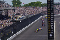 Fans fill the stands as Colton Herta leads the field in the early laps of the Indianapolis 500 auto race at Indianapolis Motor Speedway in Indianapolis, Sunday, May 30, 2021. About 135,000 spectators, about 40% of the speedway’s capacity, were admitted to the track for the largest sports event since the start of the pandemic. (AP Photo/Paul Sancya)