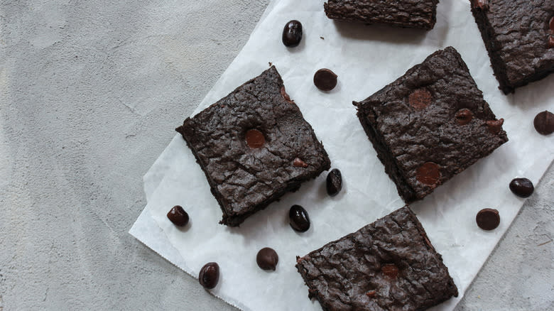 sliced brownies surrounded by black beans