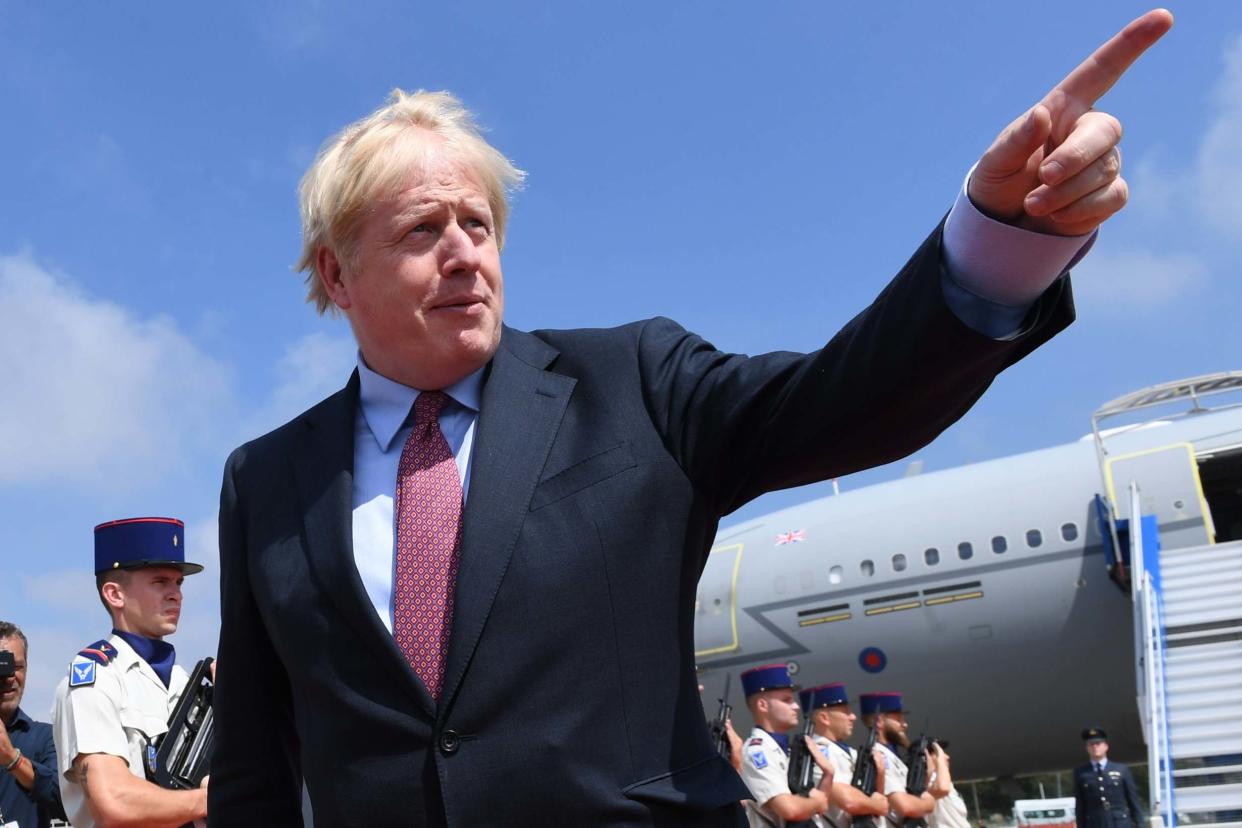 Boris Johnson disembarks a plane as he arrives in Biarritz: Getty Images