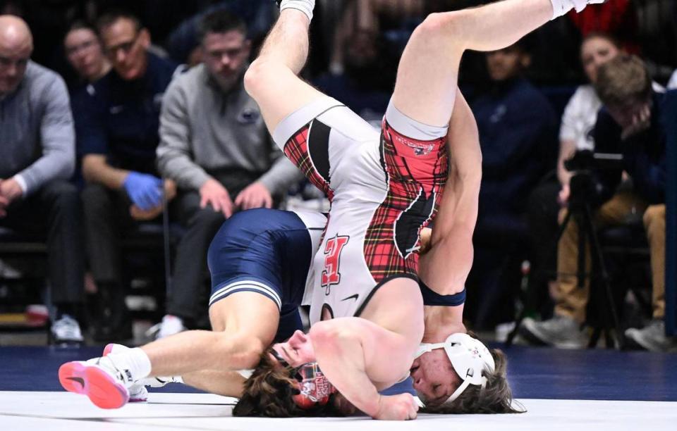 Penn State’s Tyler Kasak upends Edinboro’s Colin Roberts at 149 pounds during Sunday’s final home wrestling meet at Rec Hall in University Park. Kasak went on to defeat Roberts by pin. Penn State defeated Edinboro, 55-0. Steve Manuel/For the CDT