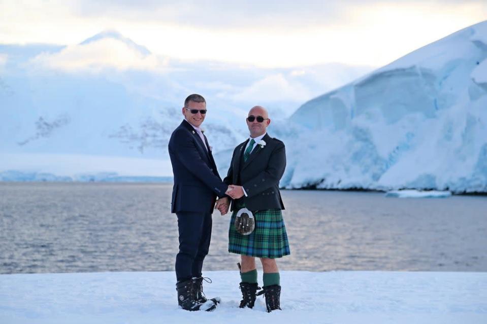 Eric Bourne and Stephen Carpenter, 41 and 49, celebrating in the British Antarctic Territory  (Richard Turner/PA)