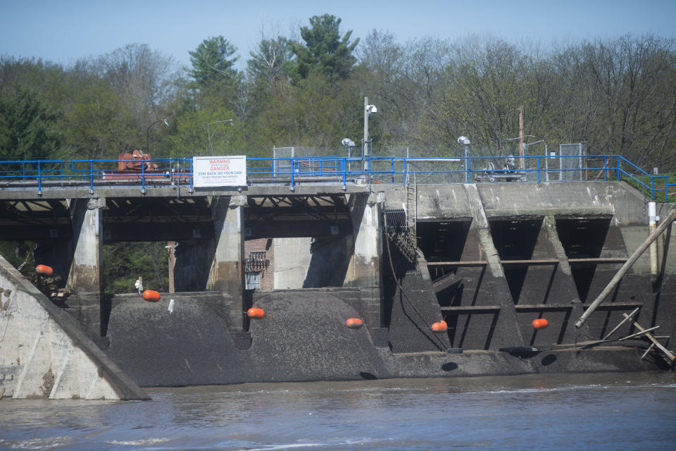 The remains of the Edenville Dam, as seen on Wednesday, May 20, 2020 in Edenville Township north of Midland. After two days of heavy rain, the Edenville Dam failed and flood waters rushed south, ravaging the landscape in its path. (Jake May/The Flint Journal, MLive.com via AP)