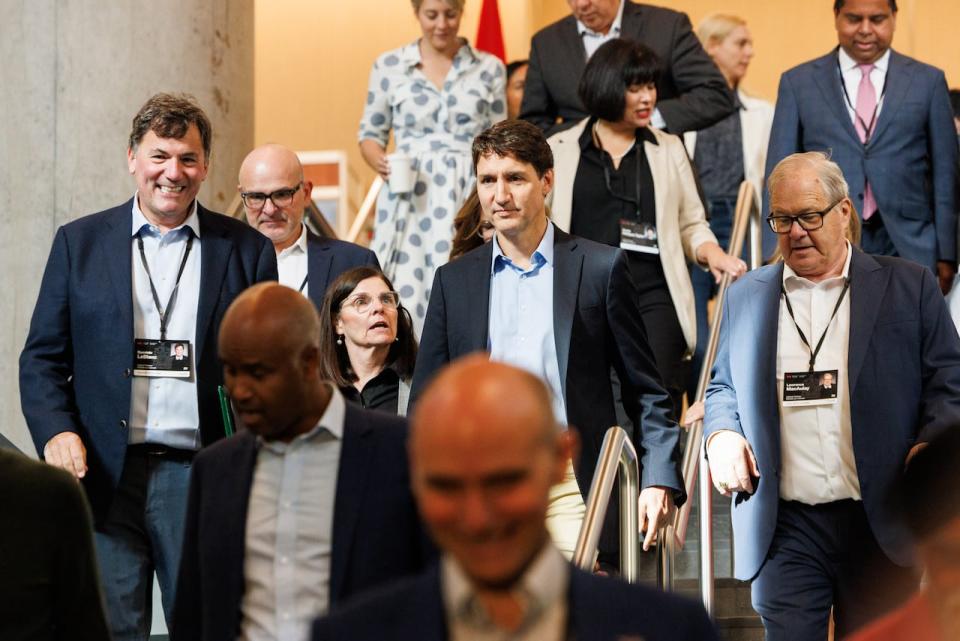 Agriculture Minister Lawrence MacAulay walks to the right of Prime Minister Justin Trudeau at the cabinet retreat in Halifax, Monday, Aug. 26, 2024. 