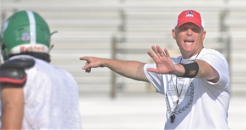 Stephenville coach Sterling Doty directs a drill during the Red Team's practice on Friday at Wylie's Hugh Sandifer Stadium.