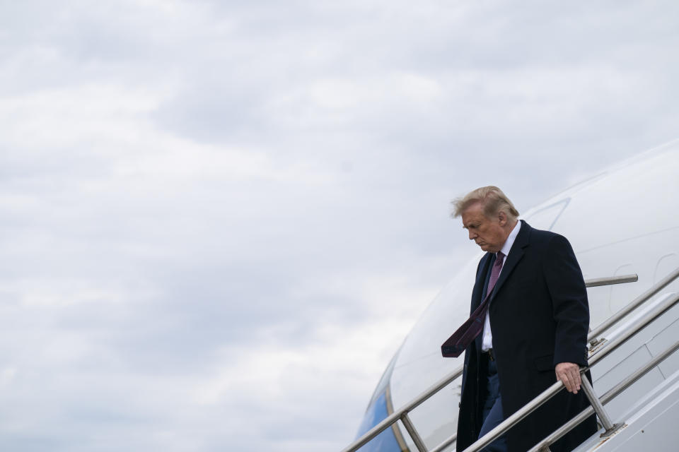 President Donald Trump arrives at Morristown Municipal Airport to attend a fundraiser at Trump National Golf Club in Bedminster, Thursday, Oct. 1, 2020, in Morristown, N.J. (AP Photo/Evan Vucci)