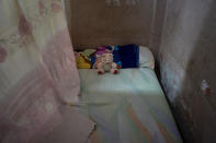 A teddy bear rests on the bed of Mackyanis Yosney Romam Rodriguez who is in prison along with her two brothers, accused of participating in the recent protests against the government, at their home in La Guinera neighborhood of Havana, Cuba, Wednesday, Jan. 19, 2022. Six months after surprising protests against the Cuban government, more than 50 protesters who have been charged with sedition are headed to trial and could face sentences of up to 30 years in prison. (AP Photo/Ramon Espinosa)