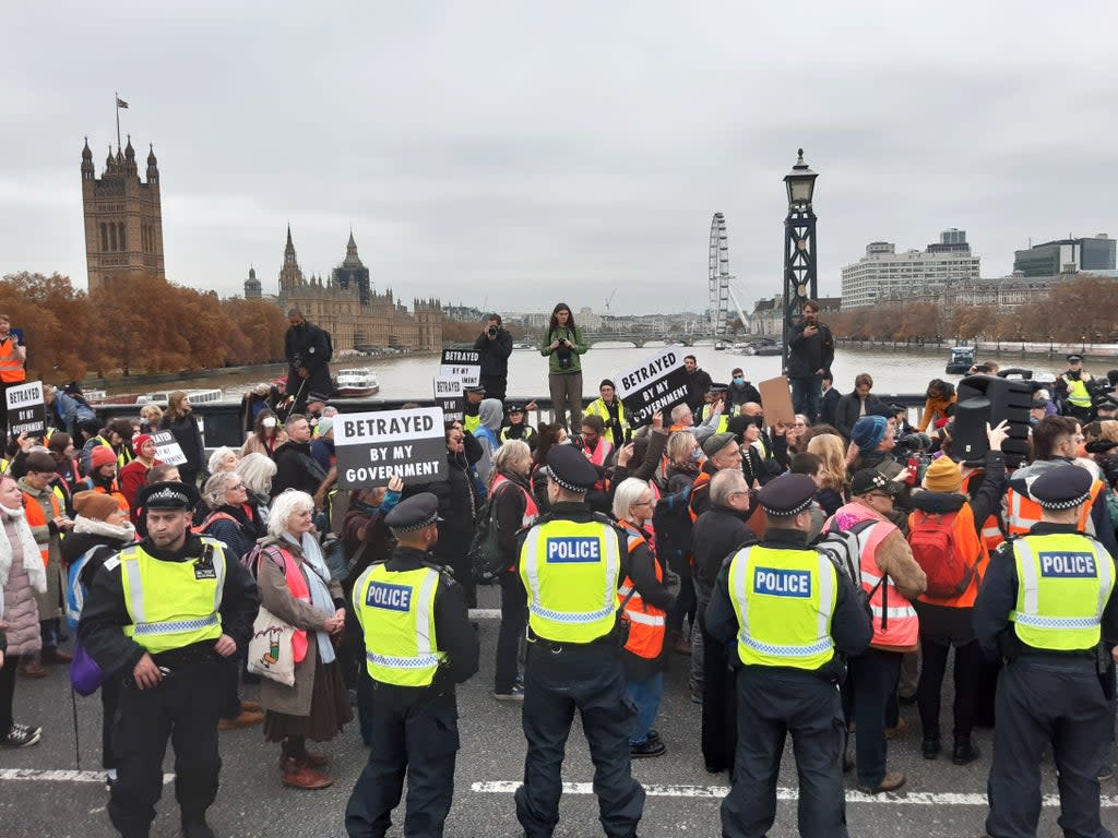 Supporters of the nine jailed Insulate Britain climate activists take part in a demonstration on Lambeth Bridge (Helen William/PA) (PA Wire)