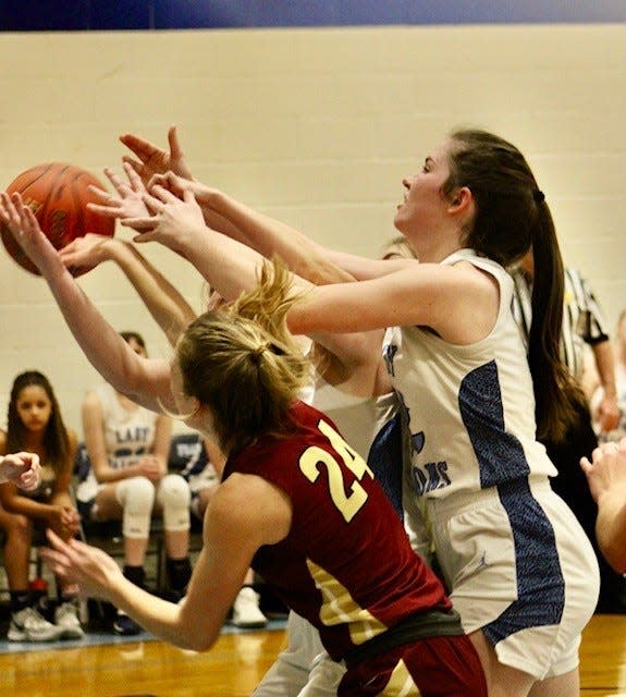 Arin Lease battles for the ball with a Trinity Christian player. Lease scored 11 points in the Falcons' victory.