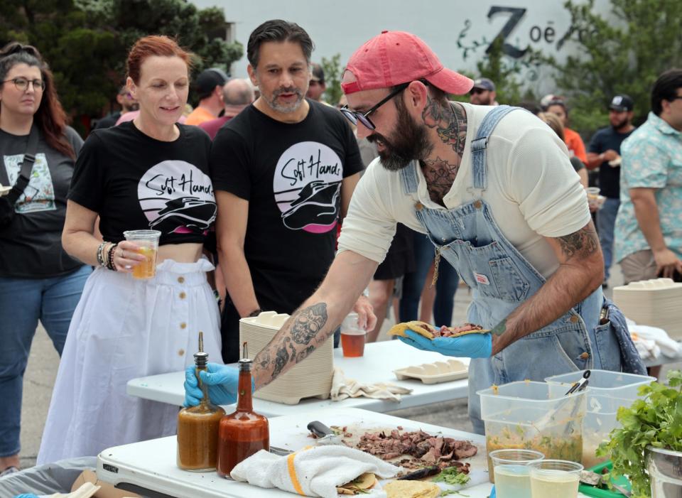 Zach Hutton cuts beef as chefs face off at VZD's in a carne asada taco competition on June 3, 2023 in Oklahoma City, Okla. [Steve Sisney/For The Oklahoman]