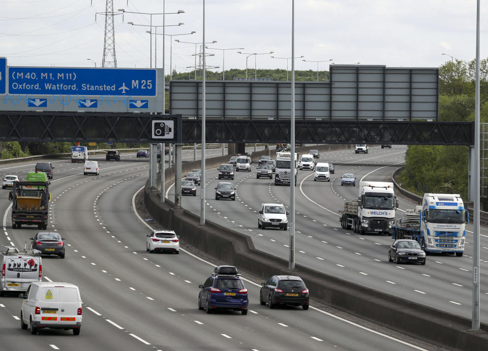 Motorists drive on the M25 near Heathrow Airport after the announcement of plans to bring the country out of lockdown.