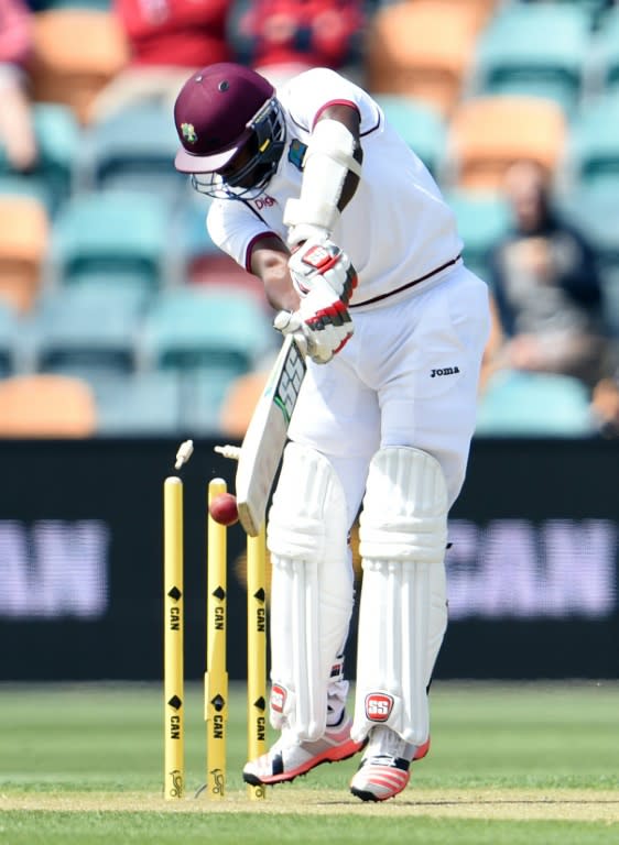 West Indies batsman Jerome Taylor is bowled by Australian paceman Josh Hazlewood on the third day of the first cricket Test match in Hobart on December 12, 2015