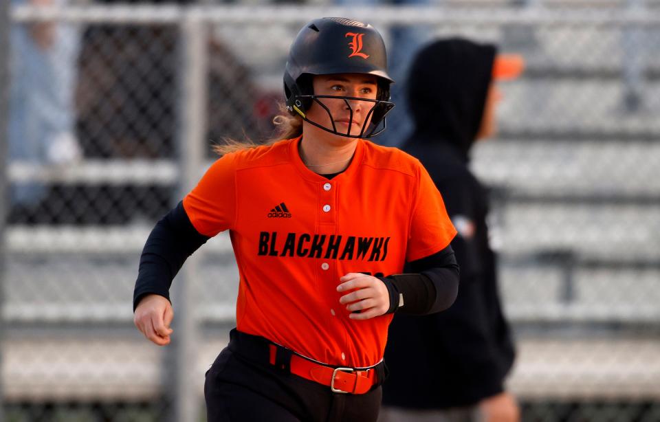 Leslie's Ada Bradford runs the bases after hitting a home run against Holt during the Greater Lansing Area Sports Hall of Fame Softball Classic, Wednesday, May 24, 2023, at Ranney Park.