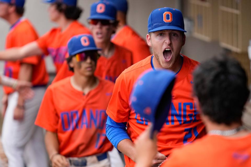 Olentangy Orange's Jacob Tabor cheers with his teammates going into the ninth inning of a Division I state semifinal at Canal Park in Akron. The Pioneers won 3-2.