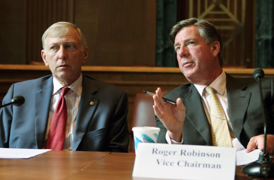 Chairman of the U.S. China committee Dick D'Amato, left, and co-chairman Roger Robinson answer questions at a news conference in 2005.