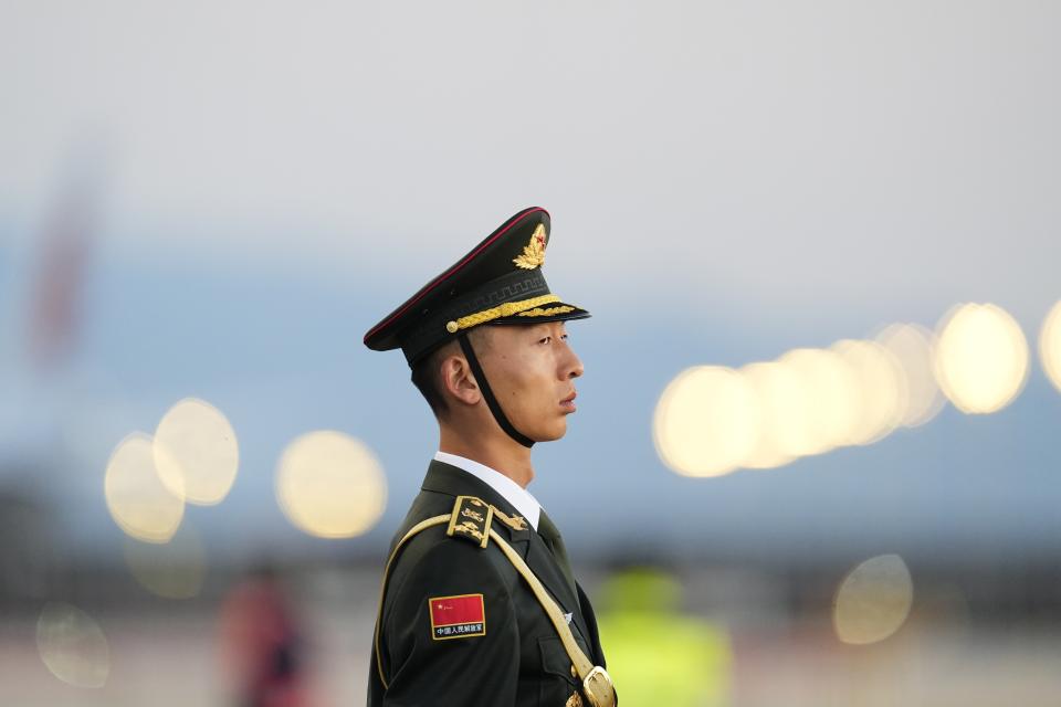 A member of an honor guard stands at Beijing Capital International Airport, prior to the arrival of Ethiopian Prime Minister Abiy Ahmed in Beijing, China, Monday, Oct. 16, 2023. (Ken Ishii/Pool Photo via AP)