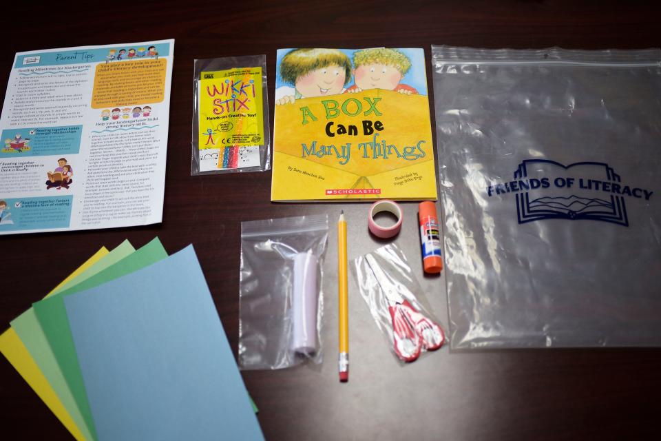 A "Literacy To Go" bag includes a book, colored paper, craft supplies and parent information from Friends of Literacy in Knoxville, Tenn. on Friday, Aug. 12, 2022. The organization provides family literacy services focusing on providing books for the home and resources for parents to help their children become better readers.