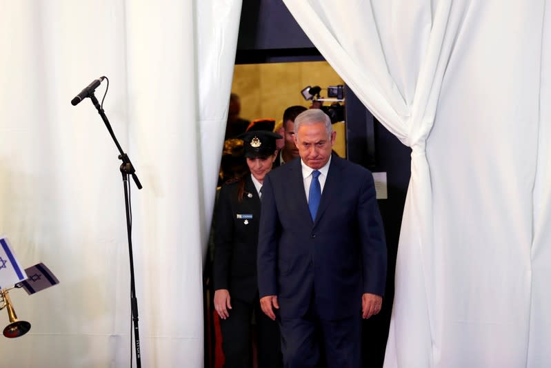 FILE PHOTO: Israeli PM Netanyahu looks on as he arrives to review an honor guard with his Ethiopian counterpart Abiy Ahmed during their meeting in Jerusalem