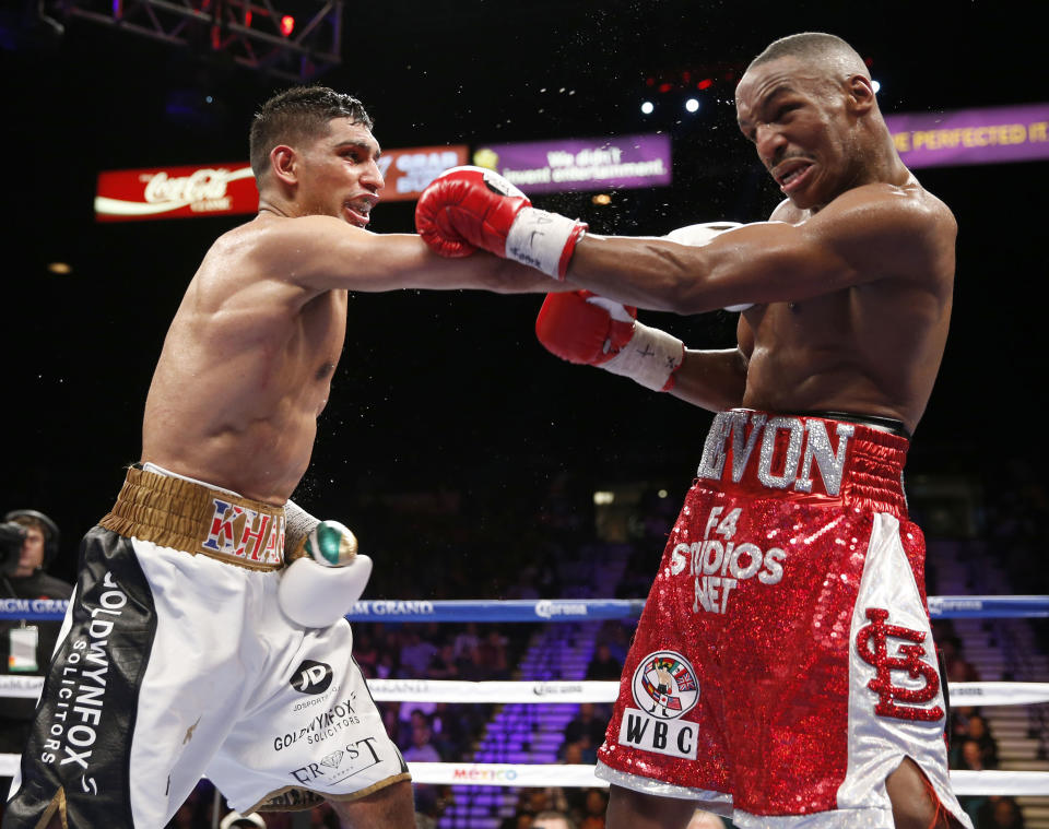 Amir Khan lands a right hand in his 2014 win over Devon Alexander. (AP)