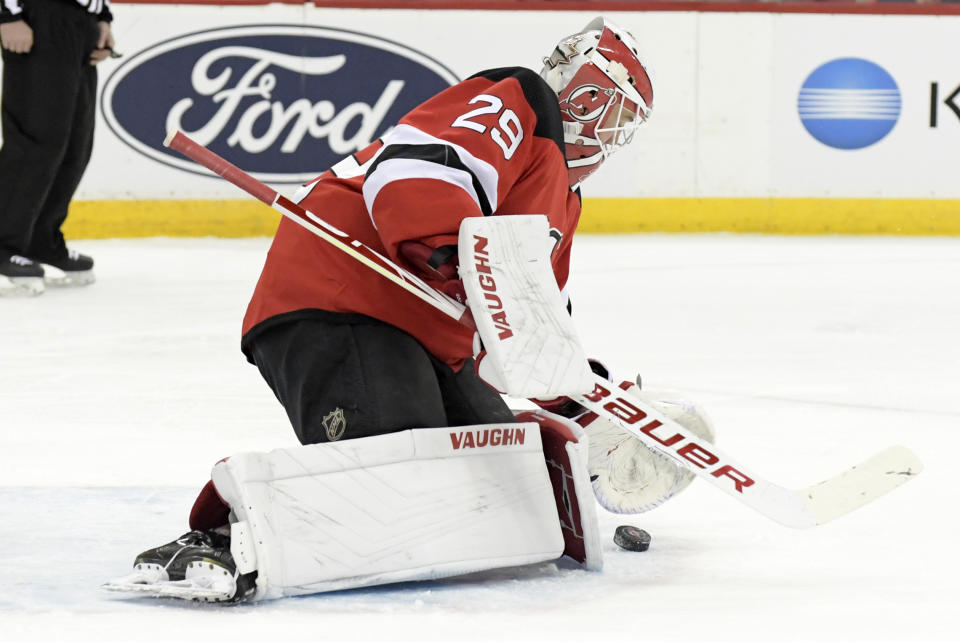 New Jersey Devils goaltender Mackenzie Blackwood (29) stops the puck during the first period of an NHL hockey game against the Los Angeles Kings, Saturday, Feb. 8, 2020, in Newark, N.J. (AP Photo/Bill Kostroun)