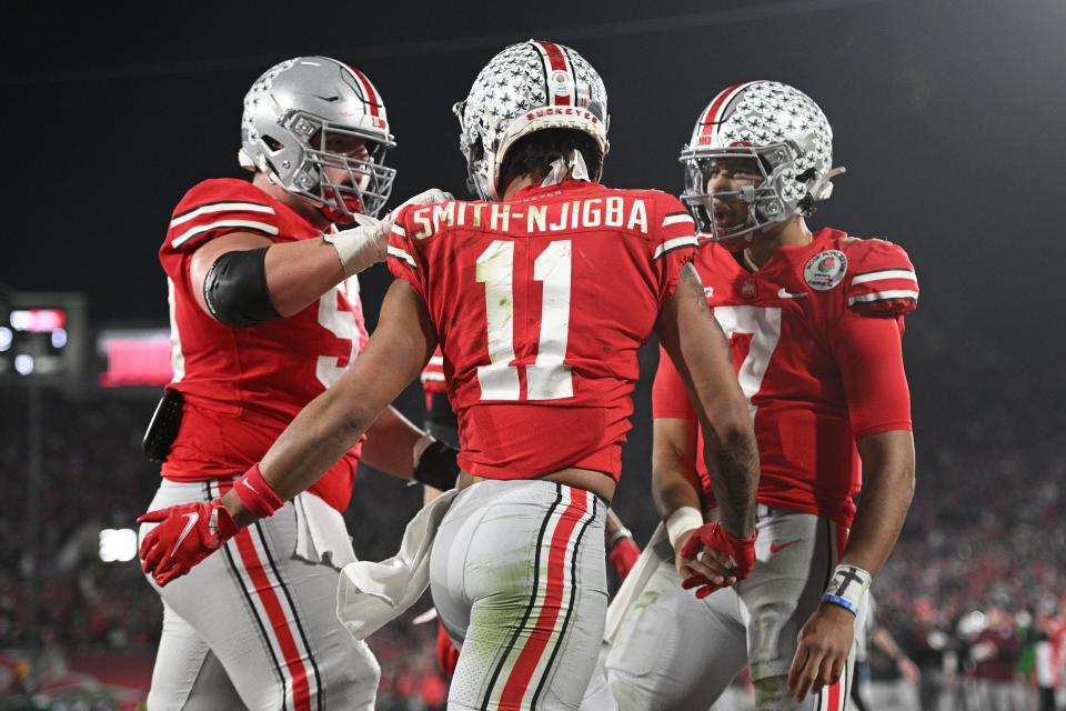 Ohio State wide receiver Jaxon Smith-Njigba celebrates with quarterback C.J. Stroud after catching a touchdown in the fourth quarter of the Rose Bowl vs. Utah.