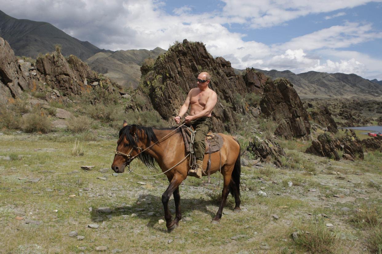 Vladimir Putin rides a horse while traveling in the mountains of the Siberian Tyva region on Aug. 3, 2009. 