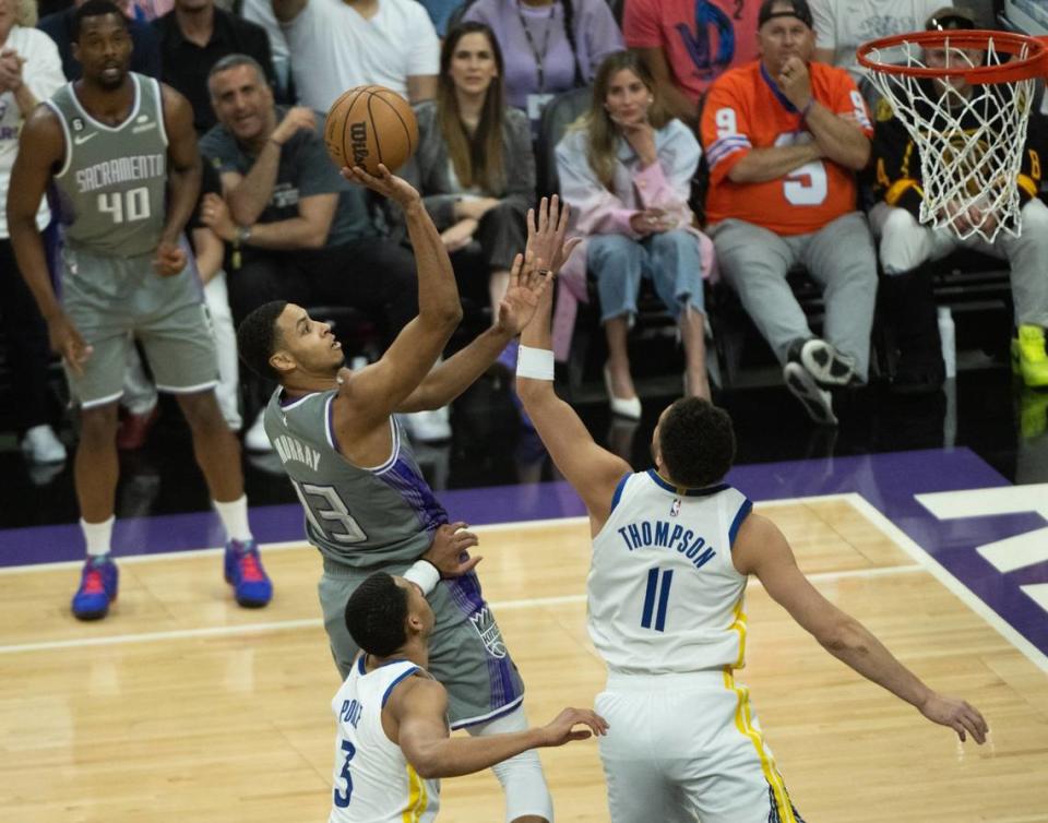 Sacramento Kings forward Keegan Murray (13) shoots over Golden State Warriors guard Klay Thompson (11) during Game 5 of the first-round NBA playoff series at Golden 1 Center on Wednesday.