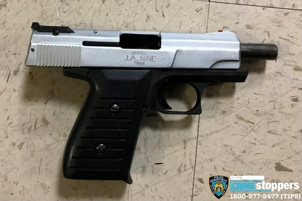 FILE - This Oct. 23, 2019 file photo provided by the New York Police Department shows a firearm recovered at the scene where police shot and killed a suspect in New York. A police officer, also shot during the incident, was in stable condition and is expected to survive. He was shot in the chest but was wearing a bullet-proof vest. A surge in violent police clashes in recent weeks has left a trail of bodies across the city and stoked tensions between officers and critics who say they have been too quick to use deadly force. (New York Police Department via AP, File)