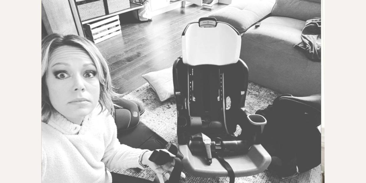 Dylan Dreyer cleaning out car seat