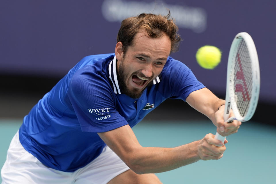 FILE - Daniil Medvedev, of Russia, hits a return to Jannik Sinner, of Italy, during a semifinal match at the Miami Open tennis tournament, Friday, March 29, 2024, in Miami Gardens, Fla. Medvedev won the 2021 U.S. Open and has been the runner-up five times at Grand Slam tournaments entering the 2024 French Open, which starts Sunday at Roland Garros in Paris.(AP Photo/Lynne Sladky, File)