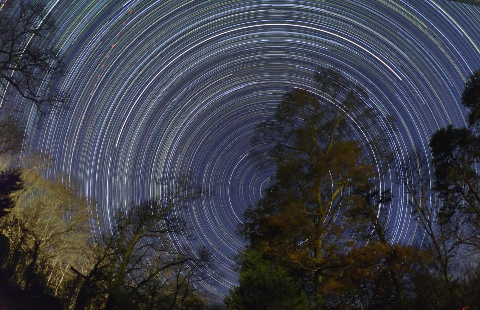 In this November 2020 photo, the night sky spirals around the North Star, center, in an overnight dusk to dawn exposure of 11 hours on a crystal clear fall evening. As the days grow shorter, more darkness means more star gazing.