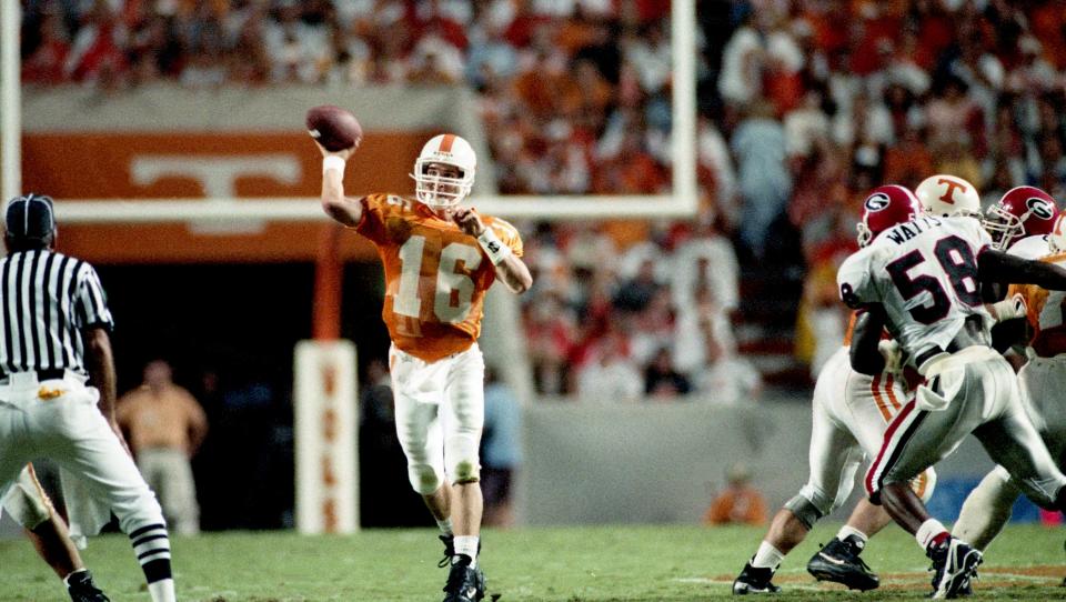 Tennessee sophomore quarterback Peyton Manning (16) fires a pass against Georgia on Sept. 9, 1995. Manning picked apart Georgia's defense for 349 yards and two touchdowns as the eighth-ranked Vols won a 30-27 shootout at Neyland Stadium in Knoxville.