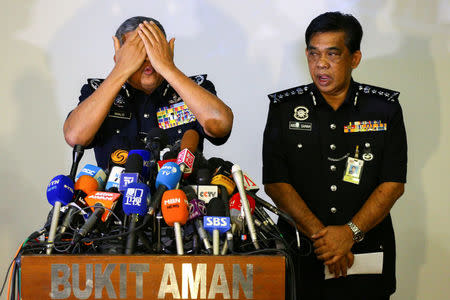 Malaysia's Royal Police Chief Khalid Abu Bakar demonstrates to the media during a news conference regarding the apparent assassination of Kim Jong Nam. REUTERS/Athit Perawongmetha