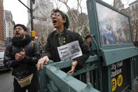 <p>Protesters shout slogans and sing to support anti-deportation protesters arrested near City Hall, Thursday, Jan. 11, 2018, in New York. The protesters said they were supporting the director of Judson Church’s New Sanctuary Coalition, who was taken in an ambulance after reporting to the Immigration and Enforcement office in lower Manhattan. (Photo: Kathy Willens/AP) </p>