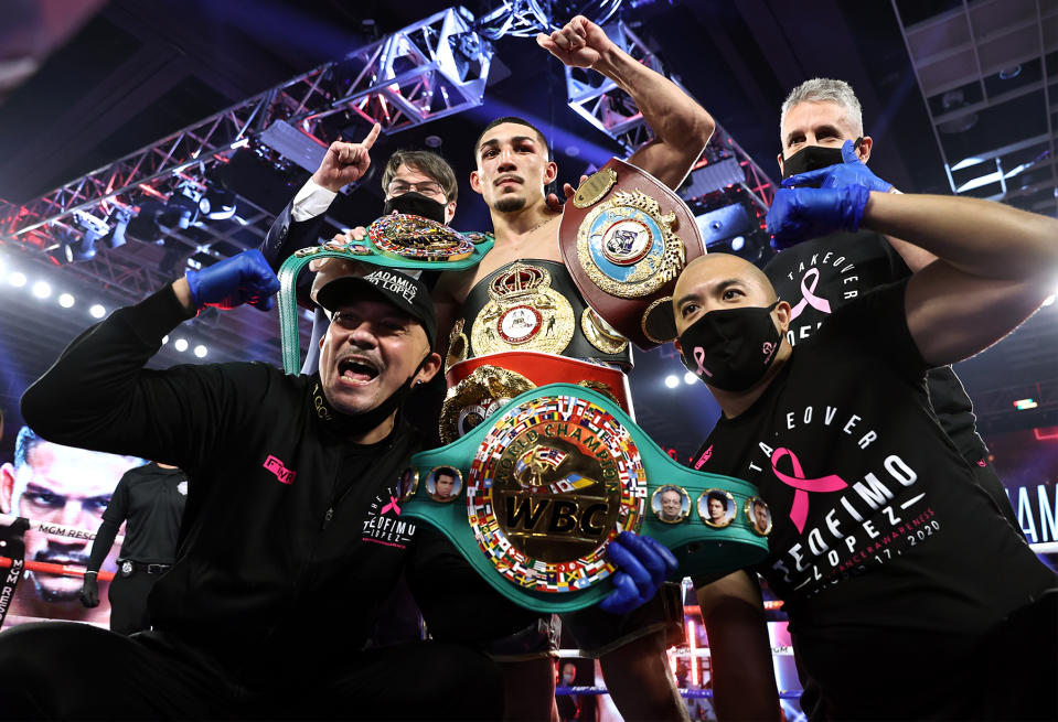 Teofimo Lopez celebrates with his team after beating Vasiliy Lomachenko (not pictured) via unanimous decision on Saturday at the MGM Grand Conference Center in Las Vegas. (Mikey Williams/Top Rank)