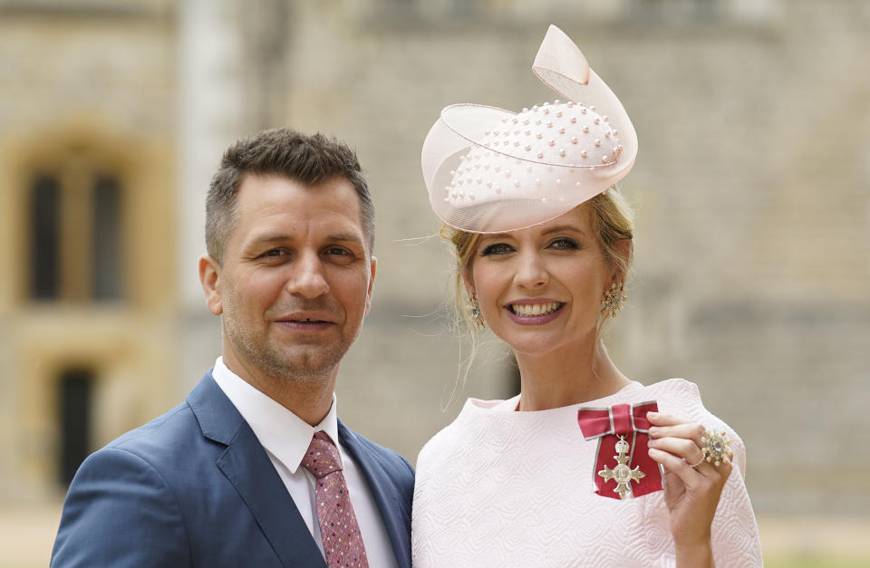 Rachel Riley, with her husband Pasha Kovalev, after she became a Member of the Order of British Empire for services to Holocaust Education, during an investiture ceremony at Windsor Castle on July 11, 2023 in Windsor, England. (Photo by Andrew Matthews - Pool/Getty Images)