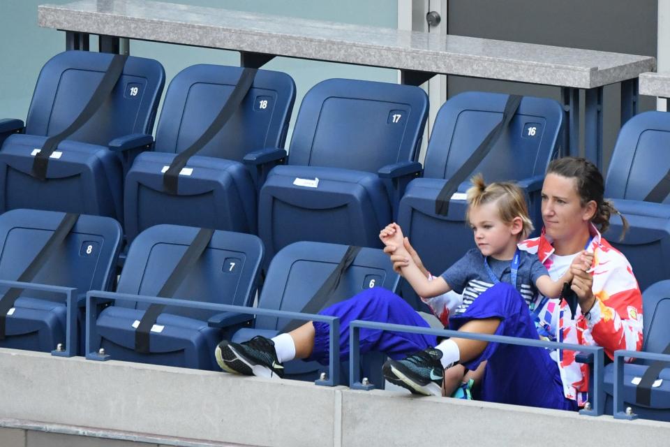 Victoria Azarenka and her son watch a 2020 US Open match from the players' suite.