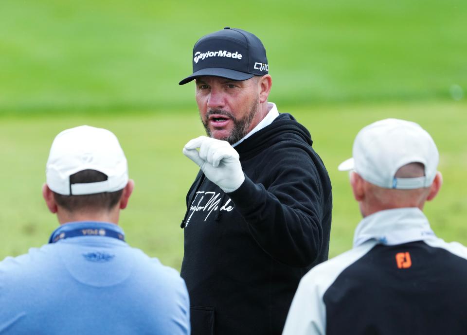 Michael Block, center, chats with folks on the driving range during a practice round for the PGA Championship on Tuesday at Valhalla Golf Club.