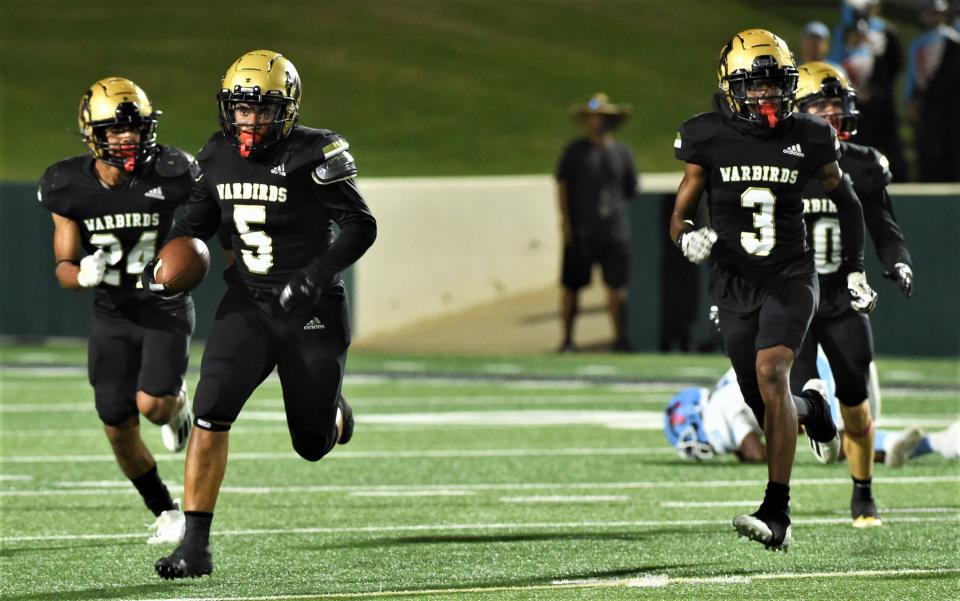 Abilene High's Kevion Williams (5) races toward the end zone after picking off a Lubbock Monterey pass. Williams returned the interception 75 yards on the final play of the first half to send the Eagles into the locker room leading 23-0.
