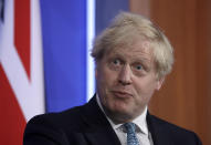 Britain's Prime Minister Boris Johnson speaking at a press conference about the ongoing coronavirus outbreak, in London, Friday, May 14, 2021. (AP Photo/Matt Dunham, Pool)