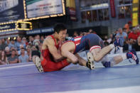 Japanese wrestler Daichi Takatani (L) spars with U.S. wrestler Zain Retherford at the "Beat The Streets" wrestling event in Times Square, New York City, U.S., May 17, 2017. REUTERS/Joe Penney