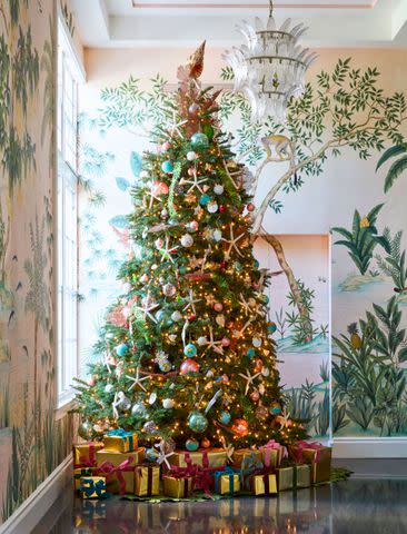 <p>Carmel Brantley; Styling by Page Mullins</p> Over 30 dozen ornaments, primarily from Aerin and D.Stevens, accent the lobby tree.
