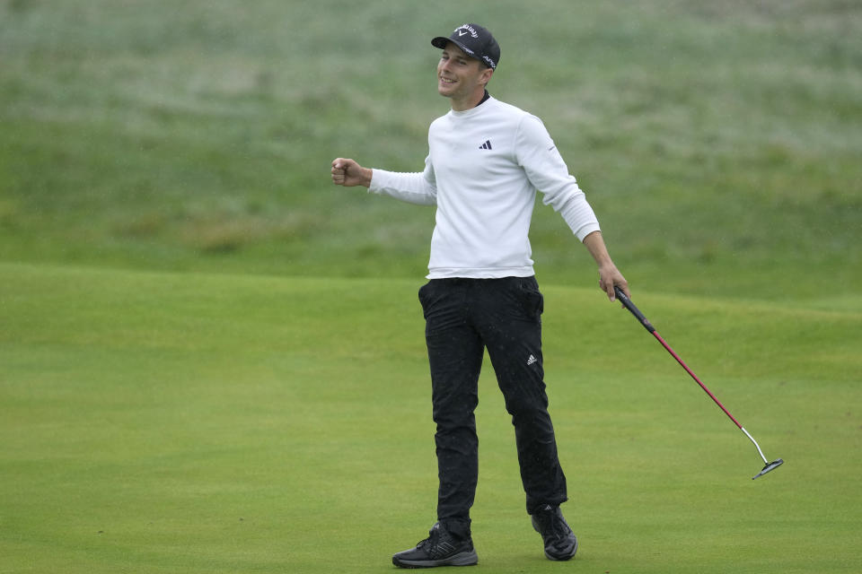 England's Matthew Jordan acknowledges the crowd after putting on the 18th green during the final day of the British Open Golf Championships at the Royal Liverpool Golf Club in Hoylake, England, Sunday, July 23, 2023. (AP Photo/Kin Cheung)