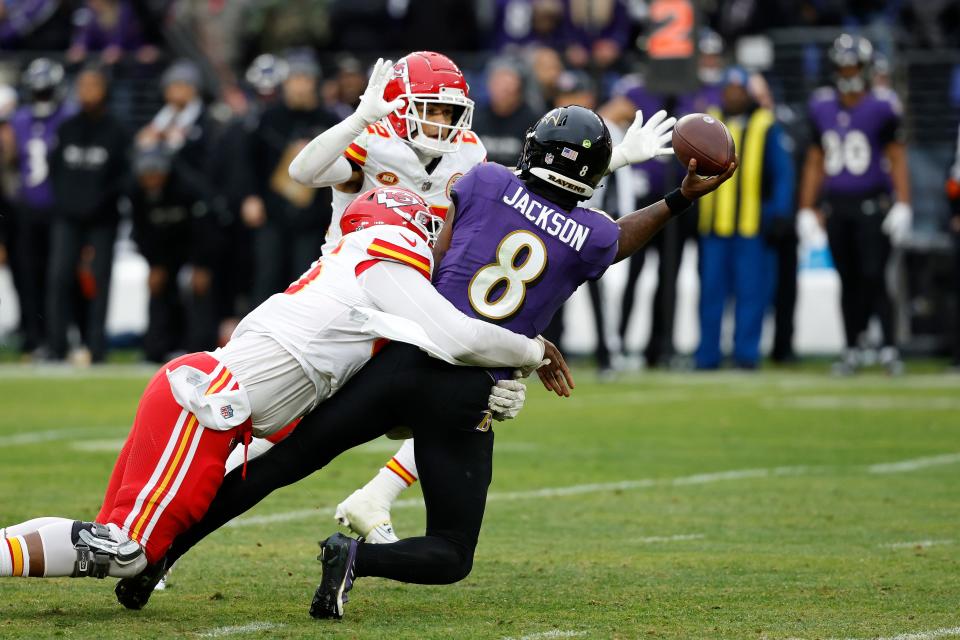 Jan 28, 2024; Baltimore, Maryland, USA; Baltimore Ravens quarterback Lamar Jackson (8) throws the ball around Kansas City Chiefs cornerback Trent McDuffie (22) while being sacked by Chiefs defensive tackle Chris Jones (95) during the first half in the AFC Championship football game at M&T Bank Stadium. Mandatory Credit: Geoff Burke-USA TODAY Sports ORG XMIT: IMAGN-748081 ORIG FILE ID: 20240128_ads_sb4_098.JPG