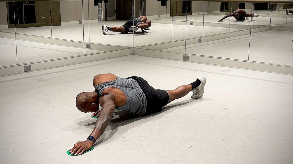 slider core exercises, spiderman push up