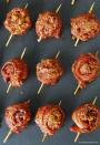 <p>These meatballs are sporting this season's hottest accessory, a sweet and sticky sash of brown sugar-glazed bacon. </p><p><em><a href="http://www.thegunnysack.com/sweet-spicy-bacon-wrapped-meatballs/" rel="nofollow noopener" target="_blank" data-ylk="slk:Get the recipe from The Gunny Sack »;elm:context_link;itc:0;sec:content-canvas" class="link "><span class="redactor-invisible-space">Get the recipe from The Gunny Sack »</span> </a></em><br></p>